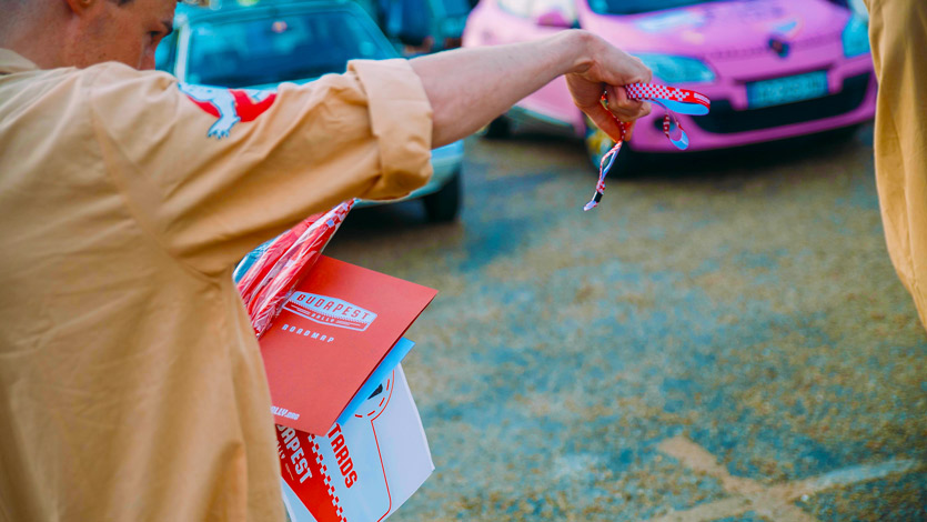 Photo of Budapest Rally bracelets, roadmap, tracker papers, cd's, car stickers and t-shirt